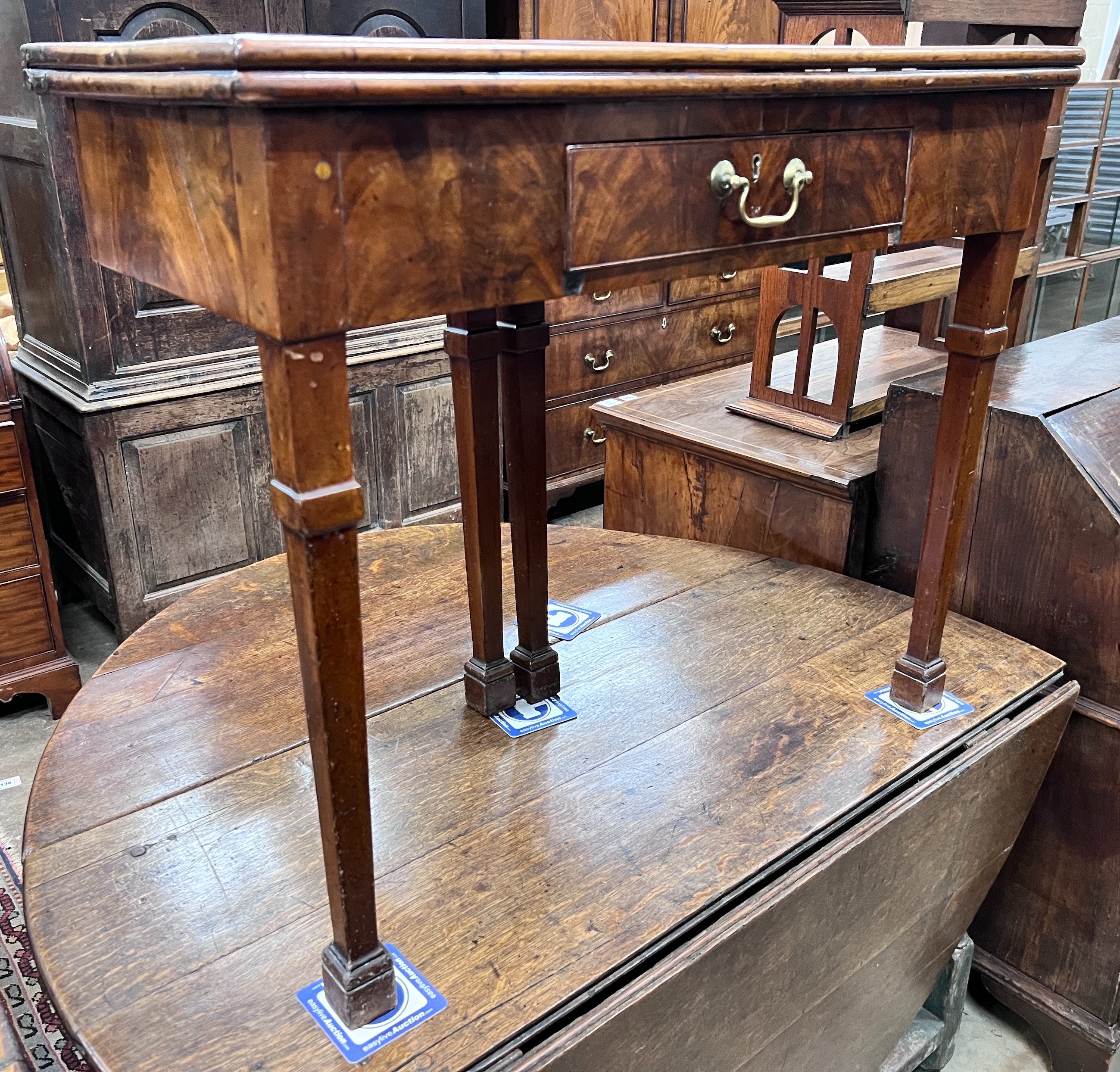 A George III mahogany rectangular folding tea table, width 86cm, depth 42cm, height 73cm *Please note the sale commences at 9am.